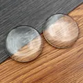 Macro shot of two round clear glass cabochon domes for DIY jewelry making pendants - 45mm / Clear