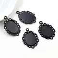 Set of four vintage matte black oval pendant bases with hollow lace edges on white background - Black Vintage Hollow Lace Style (D2-57)