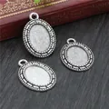 Three oval silver alloy pendant bases with woven edges on a vintage background - Silver Woven Texture Oval Bezel Base (D4-29)
