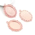 Detailed view of rose gold oval alloy pendant bases with vintage filigree for DIY jewelry - Rose Gold