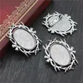 Three-piece set of vintage silver oval brooch bases with thorn frames on a wooden desk - Antique Silver Thorn Frame Style (C2-08)