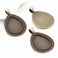 Three antique bronze teardrop pendant trays for DIY jewelry making with embossed edges - Ancient Bronze Relief Style (C3-07)