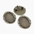 Three antique bronze oval bezel trays for DIY brooches with intricate filigree edges - Bronze Scroll Decoration Style (C3-26)