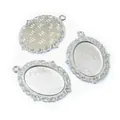 Three silver oval cabochon settings with hollow lace edge and 18x25mm inner size - White K/Silver