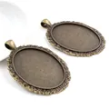 Base per pendente ovale in bronzo antico con decori barocchi per creazione gioielli fai da te - Motivo Erba Barocco Bronzo Antico (B1-22)