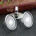 Three silver oval alloy ring bases for DIY jewelry making on a vintage wooden table - Silver Oval Grid (J3-03)