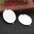 Oval silver alloy pendant base with double loops on a vintage wooden background - Silver Double Ear Hanging Loop Oval Connector (B3-35)