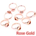 Macro shot of 8 rose gold adjustable ring bases with round settings for DIY jewelry making - Rose Gold