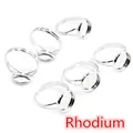 Macro detail of six rhodium-plated adjustable ring bases for DIY gemstone jewelry making - White K/Silver