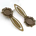 Close-up of vintage bronze metal bookmark base with 18mm cabochon setting and floral relief - Antique Bronze Round Floral Style (I1-07)