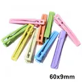 Macro shot of colorful 60x9mm macaron painted metal duckbill hair clips for DIY projects - Large Extra Long