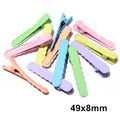 Detail view of colorful matte 49x8mm wave hair clips in candy macaron pastel shades - Wavy Edge Style
