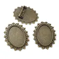 Three bronze oval brooch settings with intricate hollow edges and safety pin backing - Antique Bronze Hollow Wave Style (O7-38)