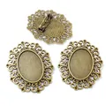Close-up of three antique bronze oval brooch bases with hollow pattern for DIY jewelry - Antique Bronze Hollow Pattern Style (V4-19)