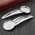 Close-up of silver drop-shaped BB hair clips with round base for DIY jewelry making - 12mm / White K/Silver