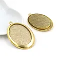 Antique gold 30x40mm oval alloy pendant trays for DIY jewelry making on white dish - Antique Gold