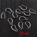 Silver plated 17x10mm DIY earwire hooks with micro-pave crystals on wooden background - Silver