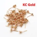 Macro shot of KC gold plated ball stud earrings with hanging loops for DIY jewelry making - 3mm / KC Gold