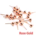 Vue macro de clous d'oreilles boules or rose de 3/4/5mm avec boucles pour bijoux DIY - Or rose
