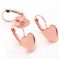 Macro view of rose gold heart-shaped leverback earring findings with serrated edges - Rose Gold