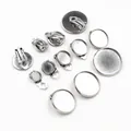 Set of various sizes stainless steel DIY clip-on earring bases on white background - 6mm / Steel