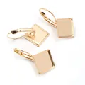 Close-up of golden lever-back earrings with square bezel settings for DIY jewelry making - KC Gold