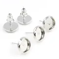 Macro view of silver stainless steel earring posts with bullet backs for DIY jewelry - White K/Silver