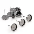 Macro view of gunmetal plated DIY stud earring bases with flat round tray and pin - Gunmetal