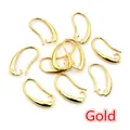Macro detail of bulk gold-plated copper ear hooks for DIY earring making and jewelry design - 19x10mm / Gold