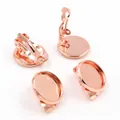 Macro view of four rose gold plated clip-on earrings with flat base trays for DIY - Rose Gold