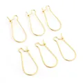 Detailed view of six golden U-shaped metal earring hooks on a clean white background - 24x11mm / Gold
