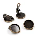 Close-up of four antique bronze DIY earring clips with round tray bases for jewelry making - 10mm / Antique Bronze