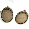 Two vintage bronze oval pendant trays with leaf relief detail and dotted edge for DIY jewelry - Vintage Leaf Relief Antique Bronze (B1-21)
