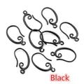 Macro shot of black vintage scroll copper earwire hooks for DIY jewelry crafting - Black