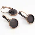 Detailed view of antique bronze leverback earring hooks with round bezel trays for DIY - Copper