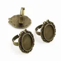 Three vintage bronze oval alloy ring settings with intricate filigree lace edges - Antique Bronze Oval Hollow Lace (L5-07)
