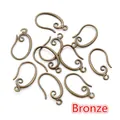 Detail of bronze DIY earring hooks with scroll patterns for jewelry making - Antique Bronze