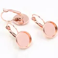 Macro detail of rose gold lever-back earring settings with round trays for DIY jewelry making - Rose Gold