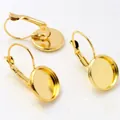 Close-up of golden leverback earring hooks with blank bezel cups for DIY jewelry - 8mm / Gold