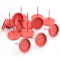 Close-up of matte red 10mm tray earring posts for DIY jewelry and resin crafts - Orange