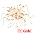 Detailed pile of 21x16mm KC Gold plated S-shape earring hooks with bead for DIY jewelry - 100 Pcs/Pack (21x16mm) / KC Gold