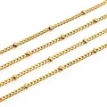 Macro shot of gold-plated curb chain with small cylinder beads for DIY jewelry making - Gold / 1.8x1.2mm