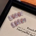 Handmade lavender cat eye press-on nails with purple shimmer and glitter accents - XS / Short Coffin (2261)