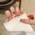 Pink gradient almond press-on nails with black flower patterns and gold foil flakes - Extra Small (XS) / Medium Long Oval (2301)