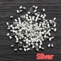 Macro shot of silver metal crimp beads for DIY jewelry making on dark wood texture - Small Specification / Silver