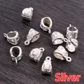 Macro view of silver alloy bail beads with intricate floral engraving for DIY jewelry - Silver