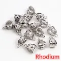 Macro detail of alloy bail bead connectors with hollow flower pattern in rhodium finish - White K/Silver