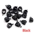 Macro detail of black alloy bail beads with intricate carved hollow patterns for jewelry DIY - Black
