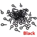 Macro shot of small black metal eye screw hooks for DIY jewelry making and crafts - Black