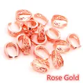 Macro detail of rose gold filigree pinch bails for vintage style jewelry making - Rose Gold